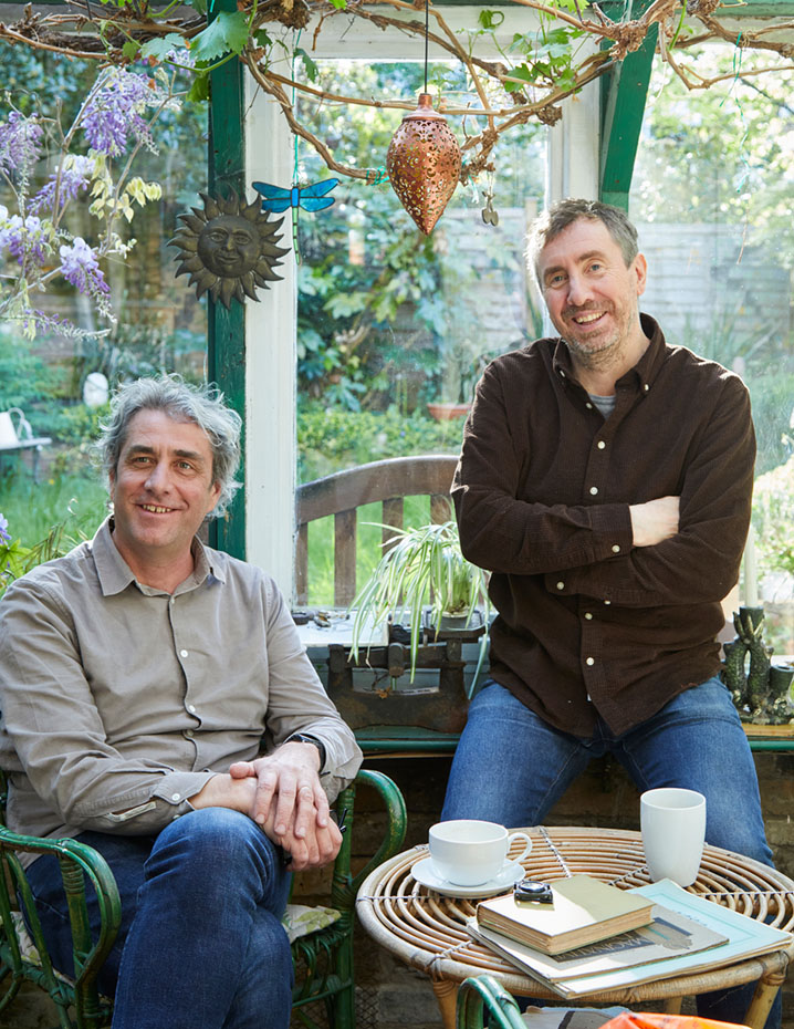 Photo of two men in a conservatory